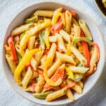 Close up of finished vegan rasta pasta in a white bowl.