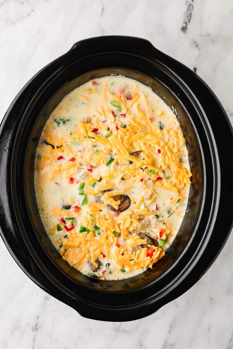 An overhead image of spreading the egg mixture on top.