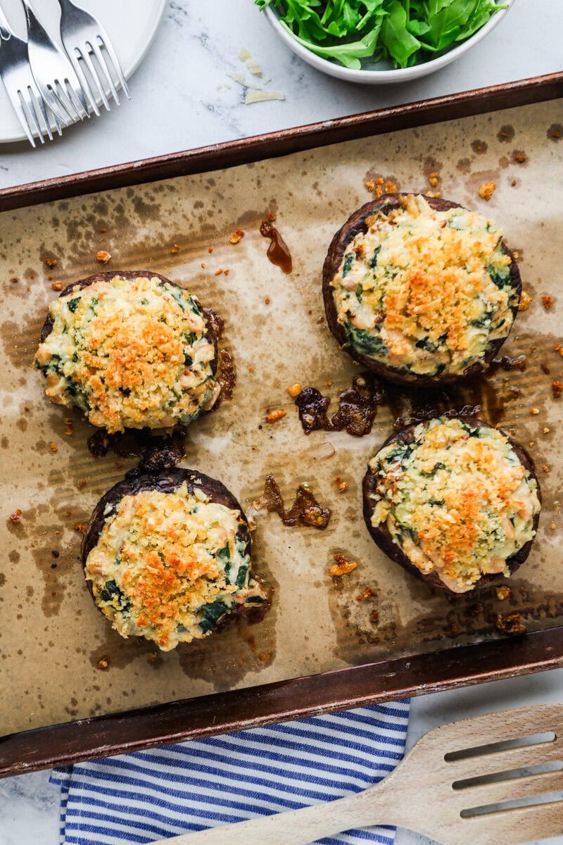 An overhead image of stuffed portobello mushrooms.