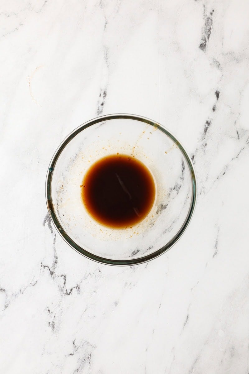 An overhead image of the balsamic vinegar mixture in a bowl.