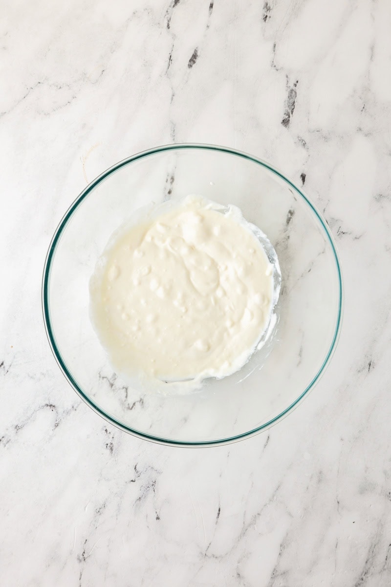 An overhead image of cottage cheese mixture in a bowl.