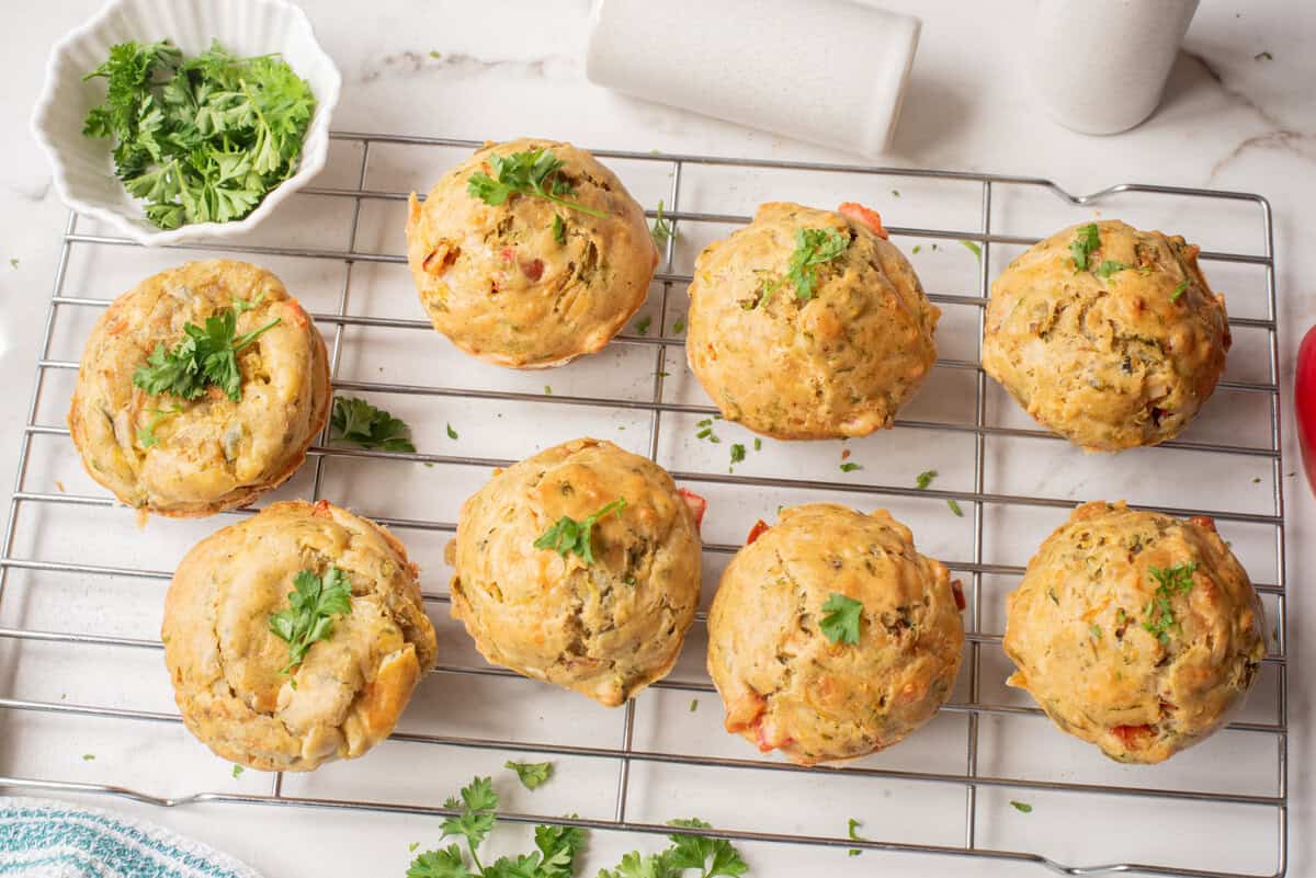An overhead image of veggie muffins on a wire rack.