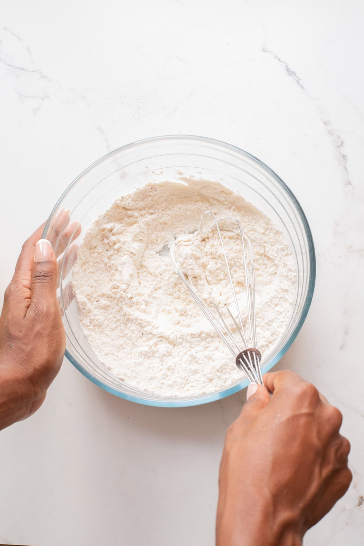 An overhead image mixing the dry ingredients together in a bowl.