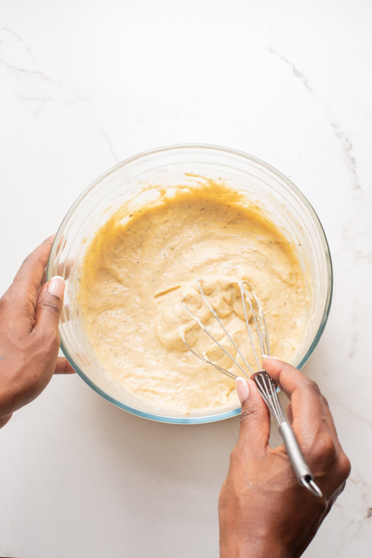 An overhead image of mixing the wet ingredients together.