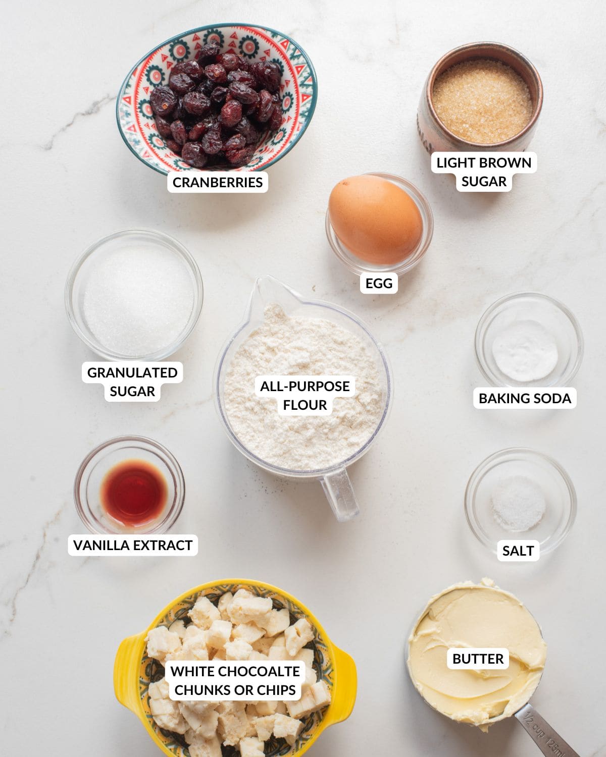 An overhead image of the ingredients of white chocolate cranberry cookies.