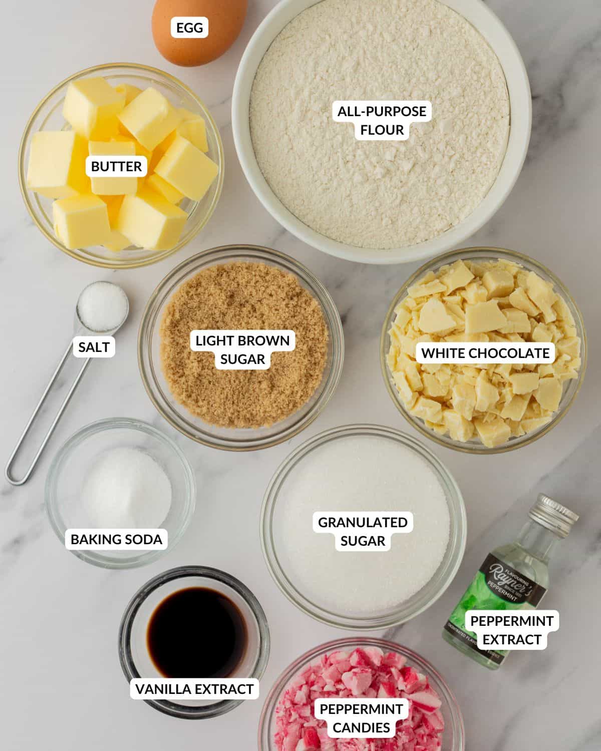 An overhead image of the ingredients of white chocolate peppermint cookies.