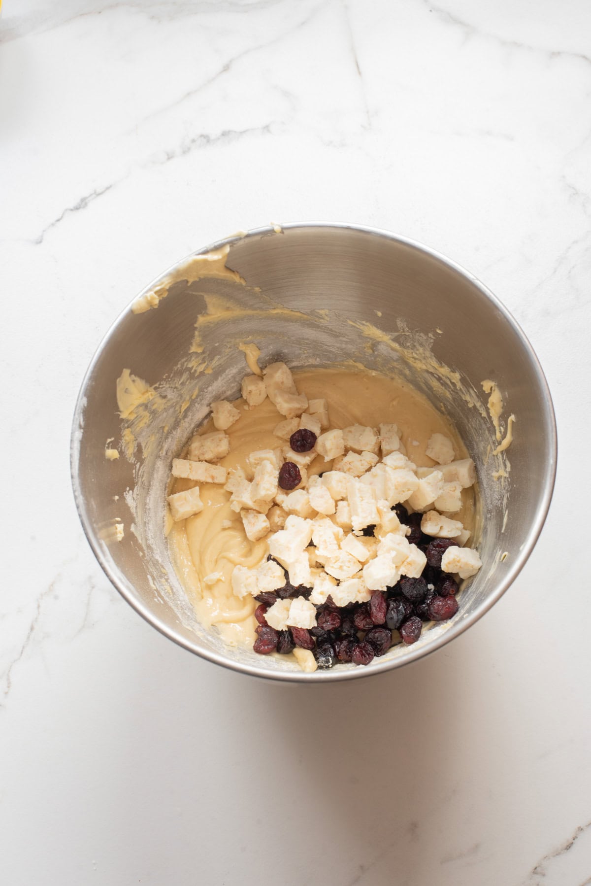 An overhead image of folding in the chocolate chips in the batter.