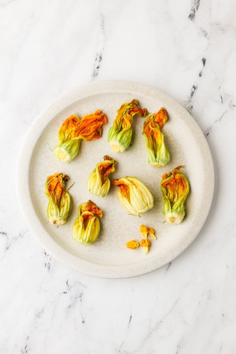 Fresh zucchini blossoms cleaned and prepared for stuffing.
