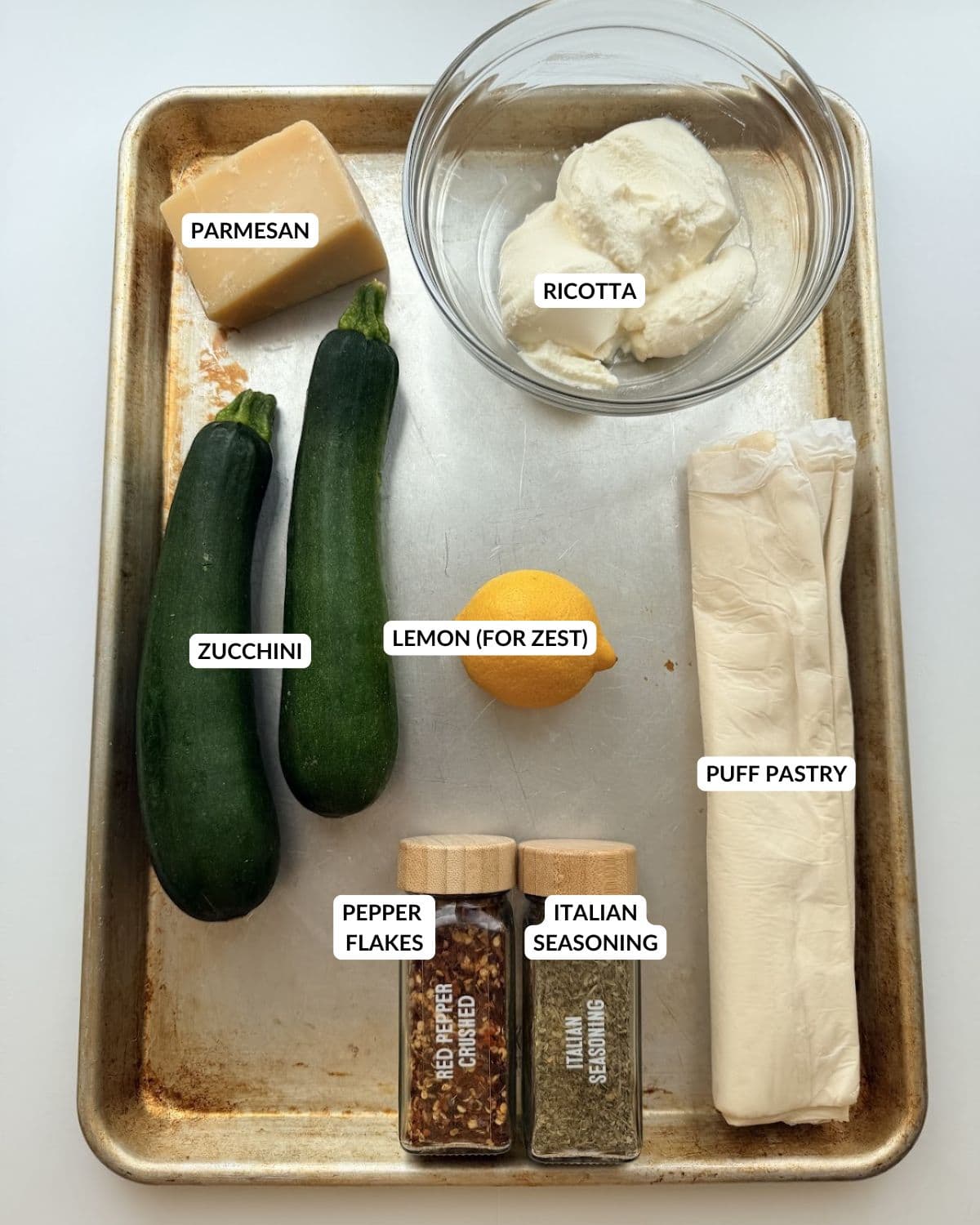 Overhead view of ingredients laid out on a sheet pan