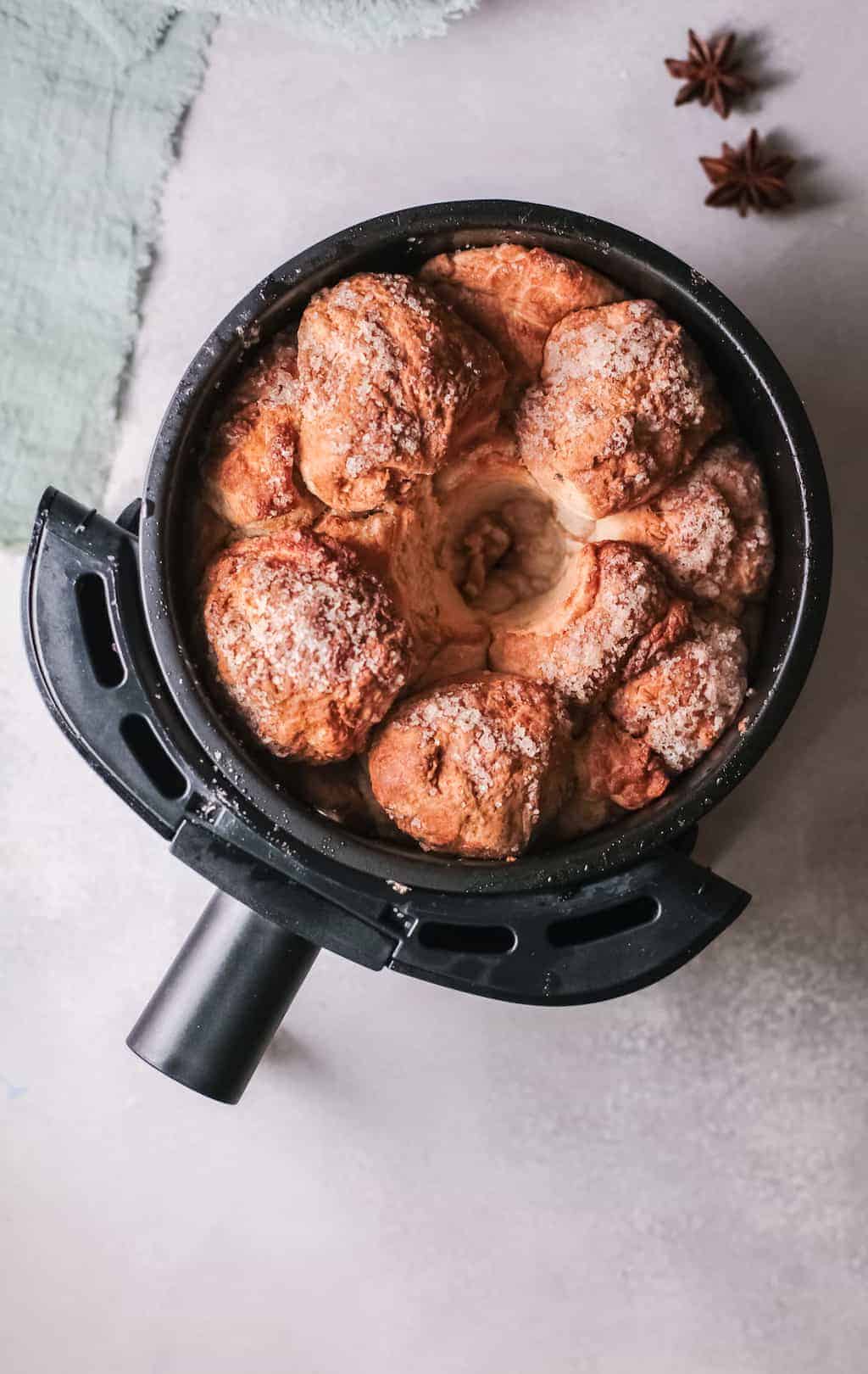 Overhead view of cooked air-fried monkey bread placed in the air-fryer basket.