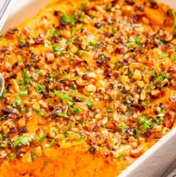 Close up image of savory sweet casserole with spoon on top