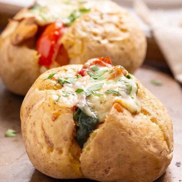 A close-up image of stuffed baked potatoes.