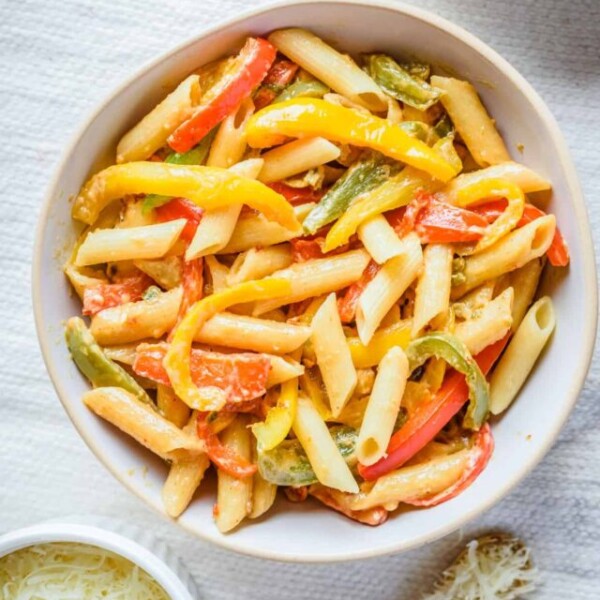 Overhead view of finished vegan rasta pasta in a white bowl.