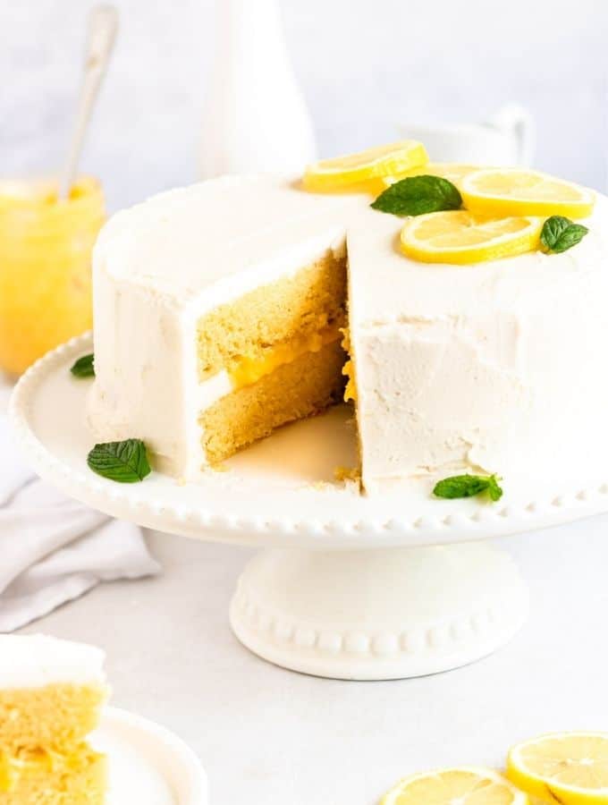 A straight view of Lemon Curd Cake with a missing slice.
