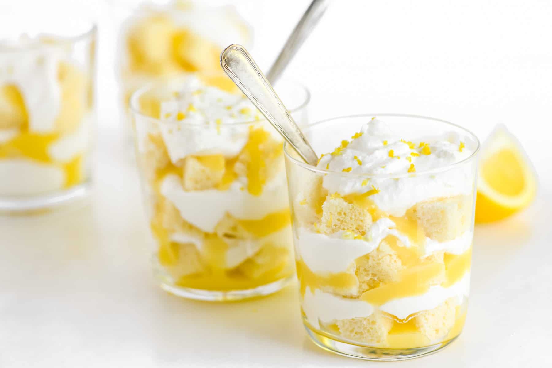 A straight view of an easy lemon trifle in a cup of glass.