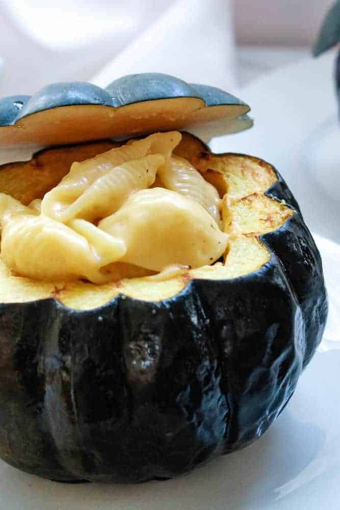 Straight photo of Mac and Cheese Stuffed Acorn Squash placed in a white plate.