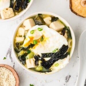 An overhead image of miso soup with tofu served in a bowl.
