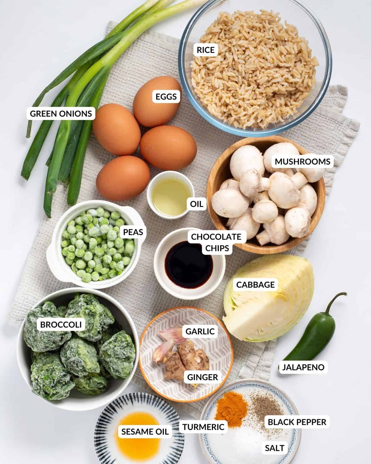 Overhead view of labeled ingredients for fried rice - check recipe card for details. 