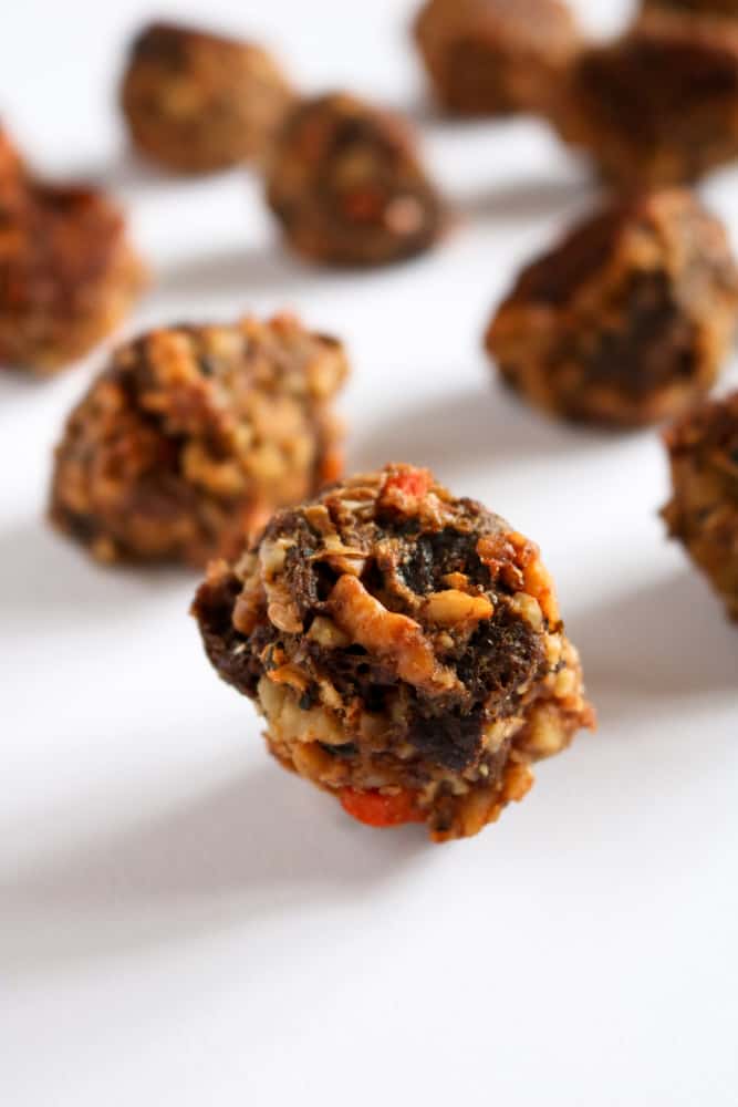 A close-up shot of several vegan stuffing balls with sausage-style walnut meat.