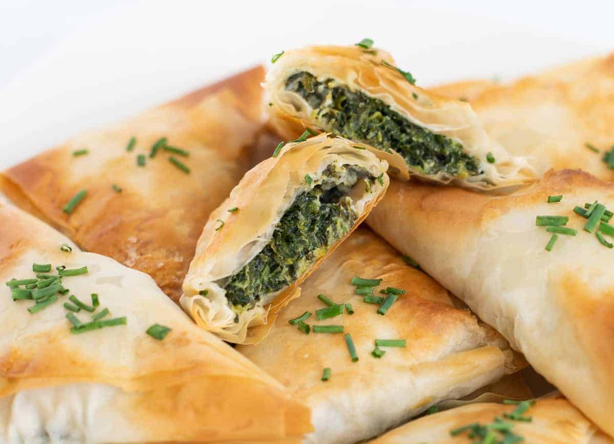 Straight close-up shot of Vegan Spanakopita topped with bits of chives.