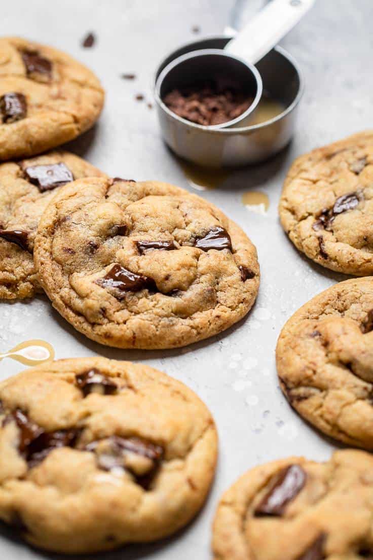 A straight view of several vegan tahini chocolate chip cookies.